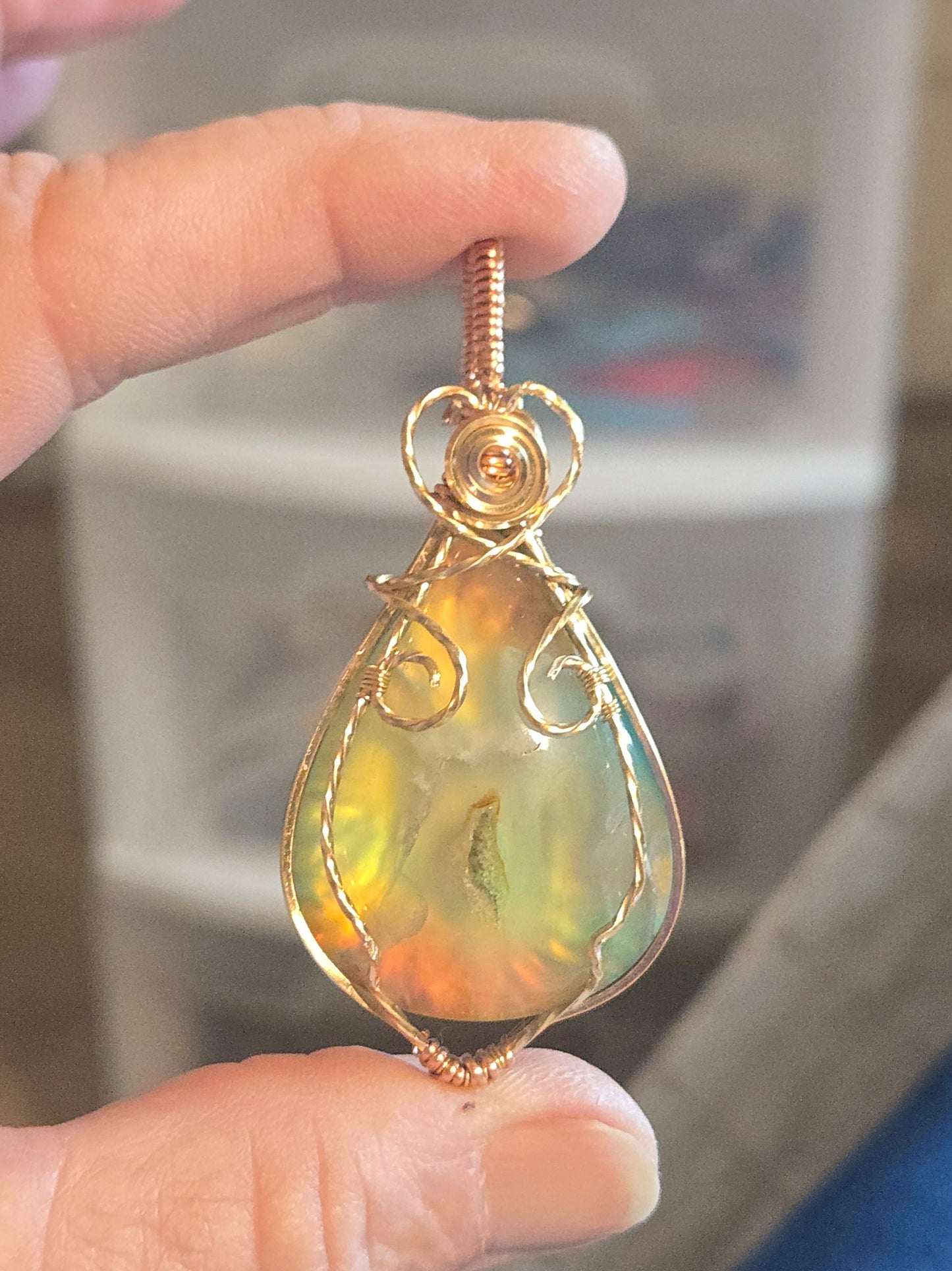 Aurora Plume Agate Doublet in Gold Plated Wire with a bit of copper.