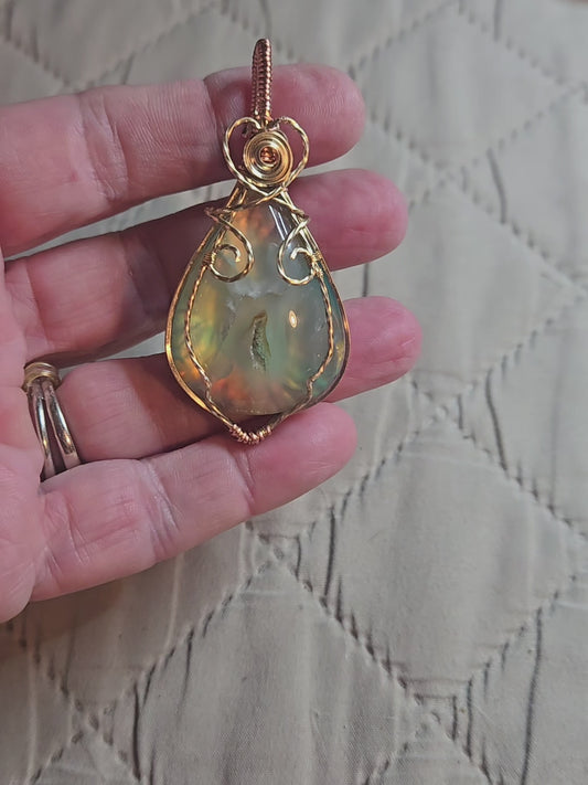Aurora Plume Agate Doublet in Gold Plated Wire with a bit of copper.